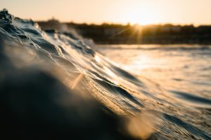 wavy body of water during golden hour